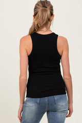woman wearing a black ribbed maternity tank top, viewed from the back with denim jeans