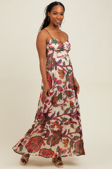 woman wearing a floral maxi dress with a sweetheart neckline and spaghetti straps