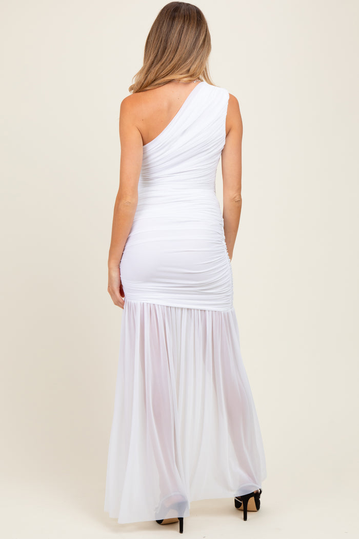 woman wearing a white one-shoulder maternity gown with ruched bodice and flowing skirt