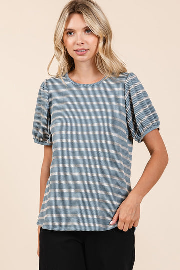 woman wearing a blue and white striped short sleeve top with puff sleeves and a relaxed fit