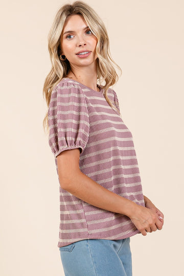 woman wearing a mauve striped short sleeve top with puff sleeves and a relaxed fit
