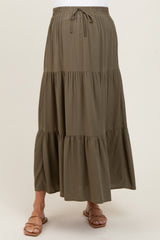 maternity wear olive green tiered maxi skirt with elastic waistband and drawstring, model wearing it without a visible baby bump