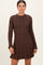woman wearing a chocolate brown ribbed knit long sleeve dress with a flared skirt and fitted bodice