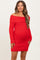 woman wearing a red off-the-shoulder knitted maternity dress with a fitted silhouette and long sleeves, showcasing her baby bump