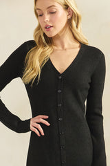 woman wearing a black ribbed long sleeve cardigan with a v-neck and button-down front