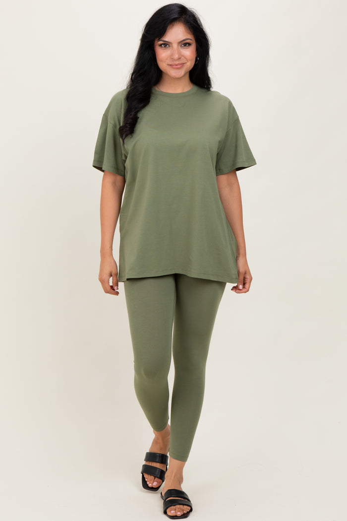 woman wearing an olive green oversized t-shirt and matching leggings with black sandals