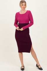 woman wearing a fitted ribbed midi dress with long sleeves in pink and dark purple colors, featuring a side slit