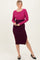 woman wearing a fitted ribbed midi dress with long sleeves in pink and dark purple colors, featuring a side slit