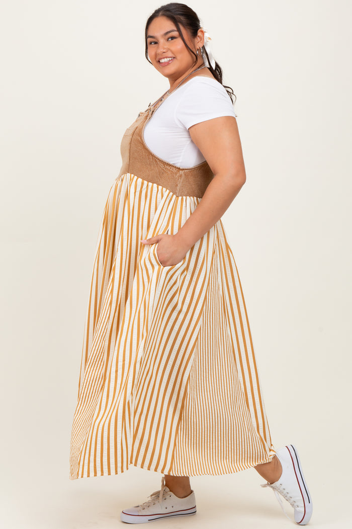woman wearing a beige and yellow striped plus size maxi dress with a tie front and pockets