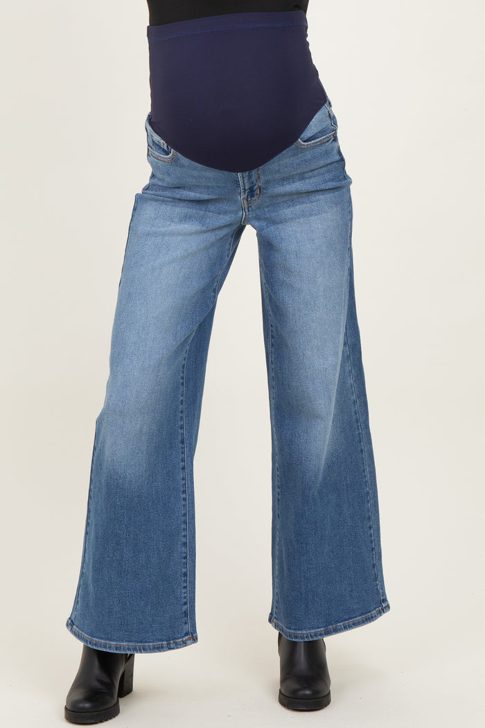 woman wearing light blue maternity wide-leg jeans with a dark blue belly panel