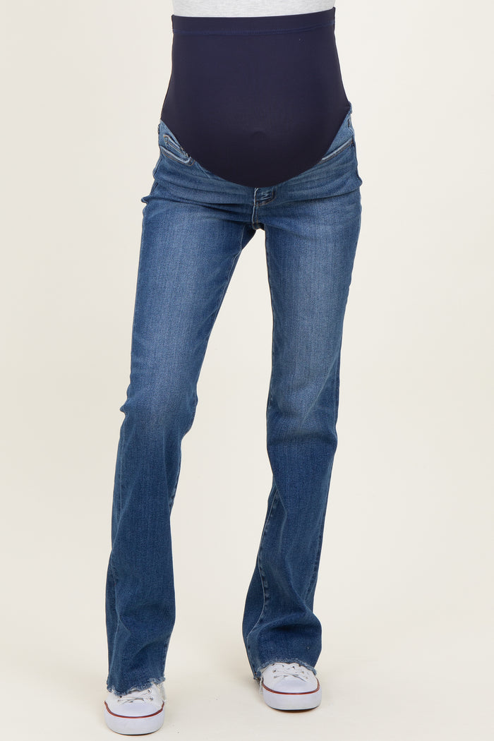 woman wearing dark blue maternity jeans with a high stretch belly panel