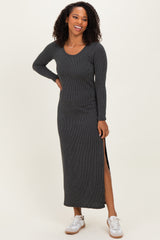 woman wearing a dark gray long sleeve ribbed maxi dress with side slits and sneakers