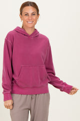 woman wearing a rose pink casual hoodie with a front pocket and relaxed fit