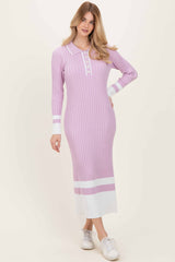 woman wearing a lavender ribbed long sleeve dress with a collared neckline and contrasting white stripes at the bottom