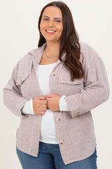 woman wearing a light pink corduroy shacket with button front and two chest pockets, paired with a white top and blue jeans
