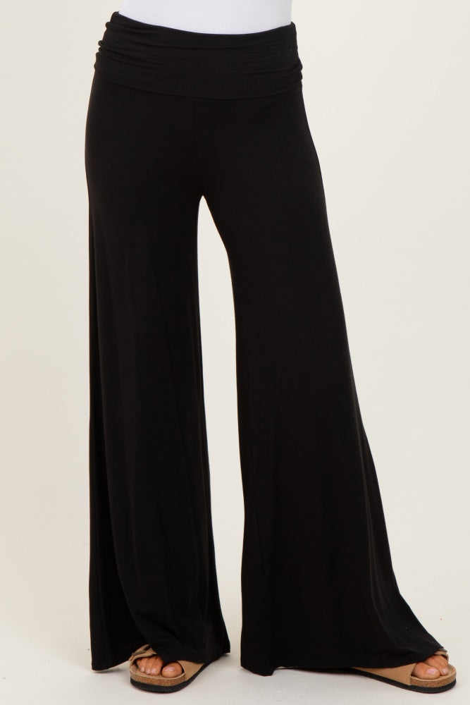 woman wearing black wide leg palazzo pants with a comfortable elastic waistband