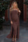 woman wearing a brown ribbed off-shoulder maternity dress with a matching long cardigan and a visible baby bump
