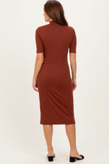 woman wearing a brown ribbed midi dress with short sleeves and a fitted silhouette, seen from the back