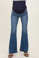 maternity wear blue flared jeans with a dark waistband, model showing a baby bump