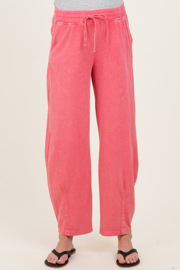 woman wearing pink maternity wide-leg pants with an elastic waistband and drawstring