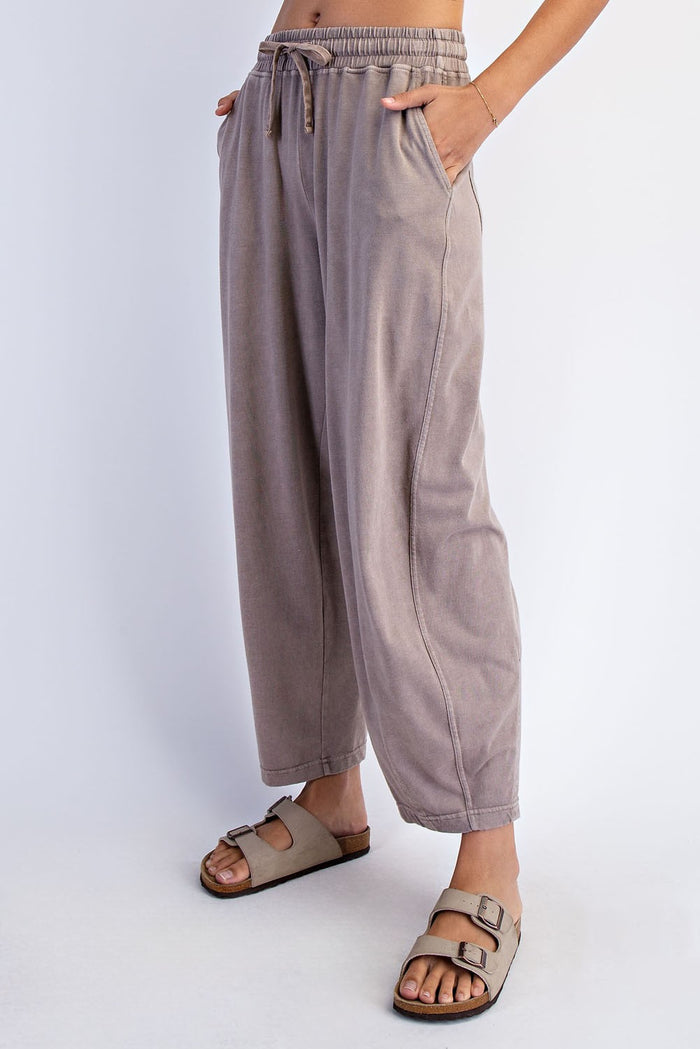 woman wearing relaxed fit taupe drawstring pants with side pockets and casual sandals