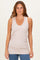 woman wearing a blush sleeveless ribbed tank top with a v-neckline and gathered sides