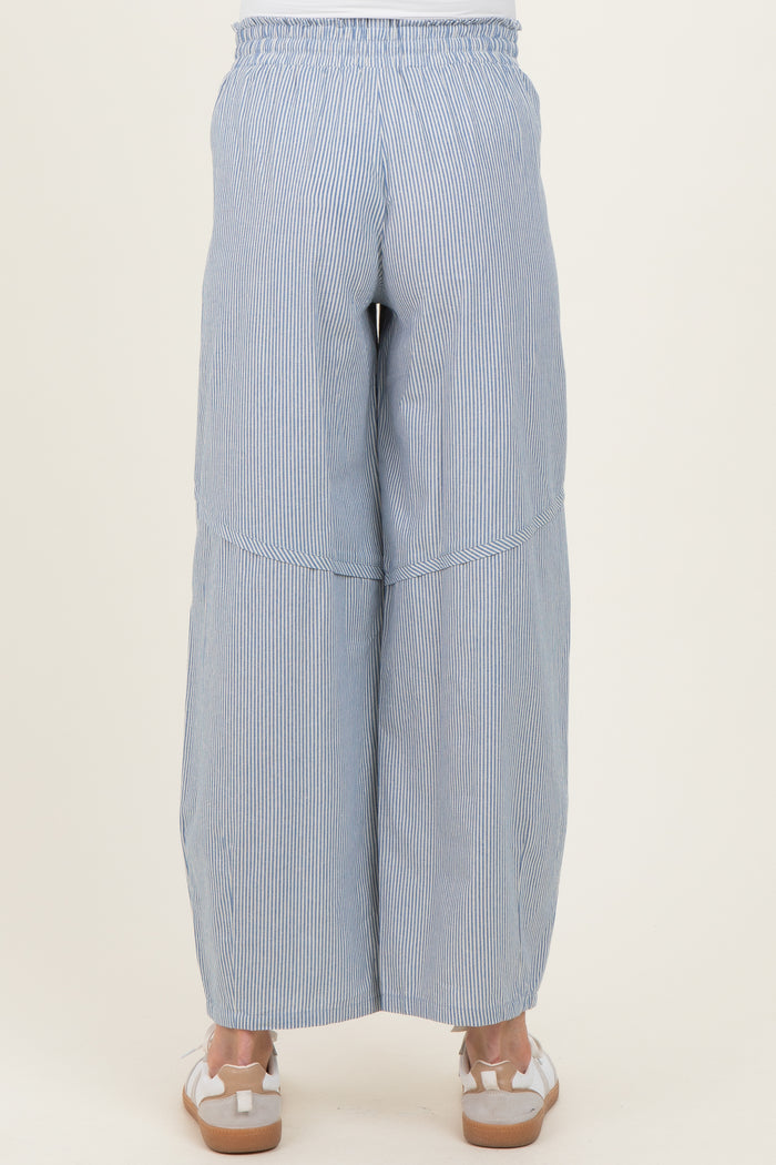 woman wearing navy and white striped maternity wide-leg pants, seen from the back