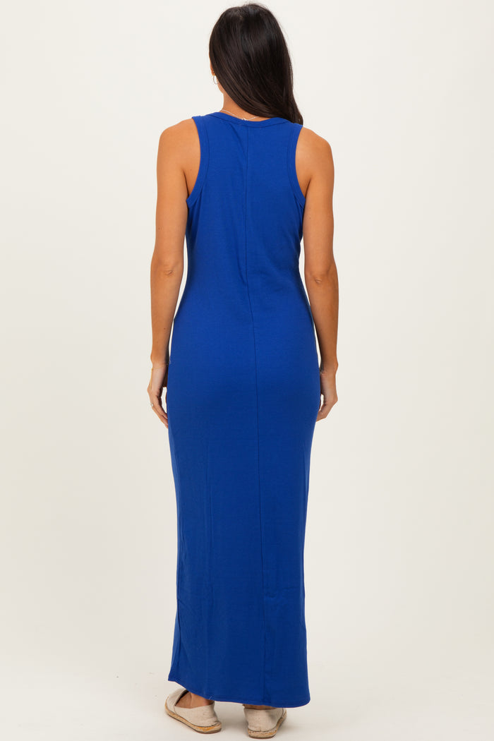 woman wearing a blue sleeveless maxi dress, shown from the back