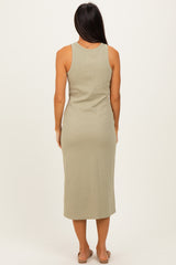woman wearing a sage green sleeveless midi dress, viewed from the back