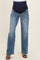 woman wearing light blue maternity jeans with a navy over-the-bump panel and distressed details