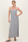 woman wearing a gray and white striped maxi dress with a fitted bodice and relaxed skirt