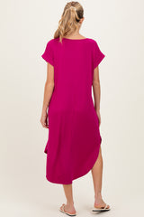 woman wearing a hot pink maternity midi dress with short sleeves and a slit on the side