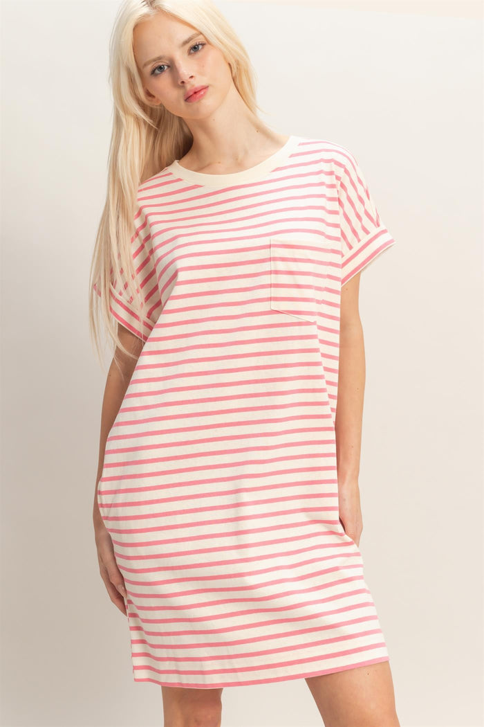 woman wearing a pink and white striped short sleeve dress with a pocket