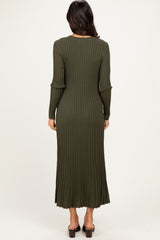 woman wearing a long olive green ribbed dress with long sleeves and a fitted silhouette, viewed from the back
