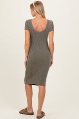 woman wearing a short sleeve olive green ribbed maternity dress with a scoop back