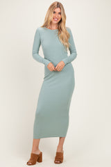 woman wearing a fitted long sleeve mint green ribbed maxi dress and brown heeled mules