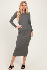 woman wearing a long sleeve gray bodycon midi dress and black slide sandals