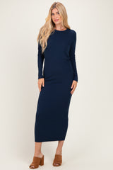woman wearing a navy ribbed long sleeve maxi dress and brown heeled sandals