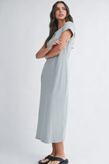 woman wearing a light gray short sleeve midi dress with a relaxed fit and side slits