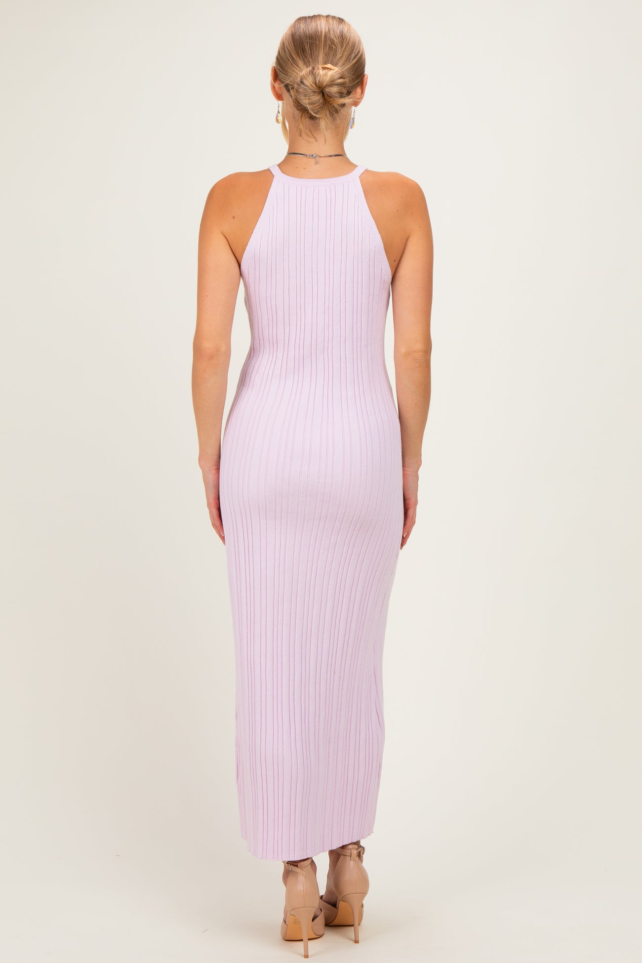woman wearing a light lavender ribbed sleeveless maxi dress, showing the back view