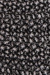 black floral maternity dress with gathered tiers and a fitted bodice