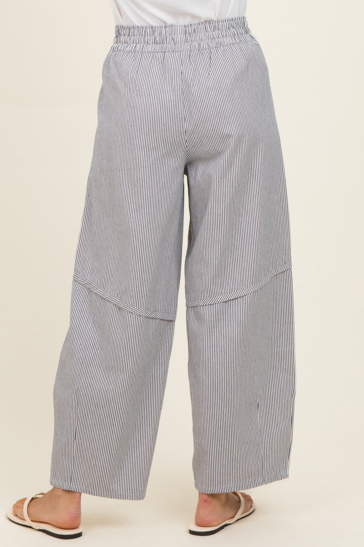 woman wearing blue and white striped wide-leg pants with a comfortable elastic waistband and side seam detailing