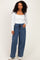 woman wearing a white long sleeve square neck top and blue pinstriped wide-leg pants with drawstring waist