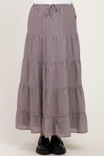 maternity wear tiered maxi skirt in brown and cream gingham pattern with a drawstring waist, styled with black shoes