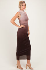 woman wearing a sleeveless ombre midi dress with a fitted bodice and sheer hem, paired with nude heeled sandals