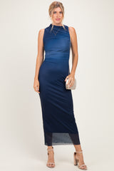 woman wearing a navy blue sleeveless midi dress with ruching and a sheer hem, holding a small clutch purse