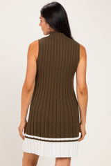 woman wearing a sleeveless olive green ribbed knit dress with a white striped hem