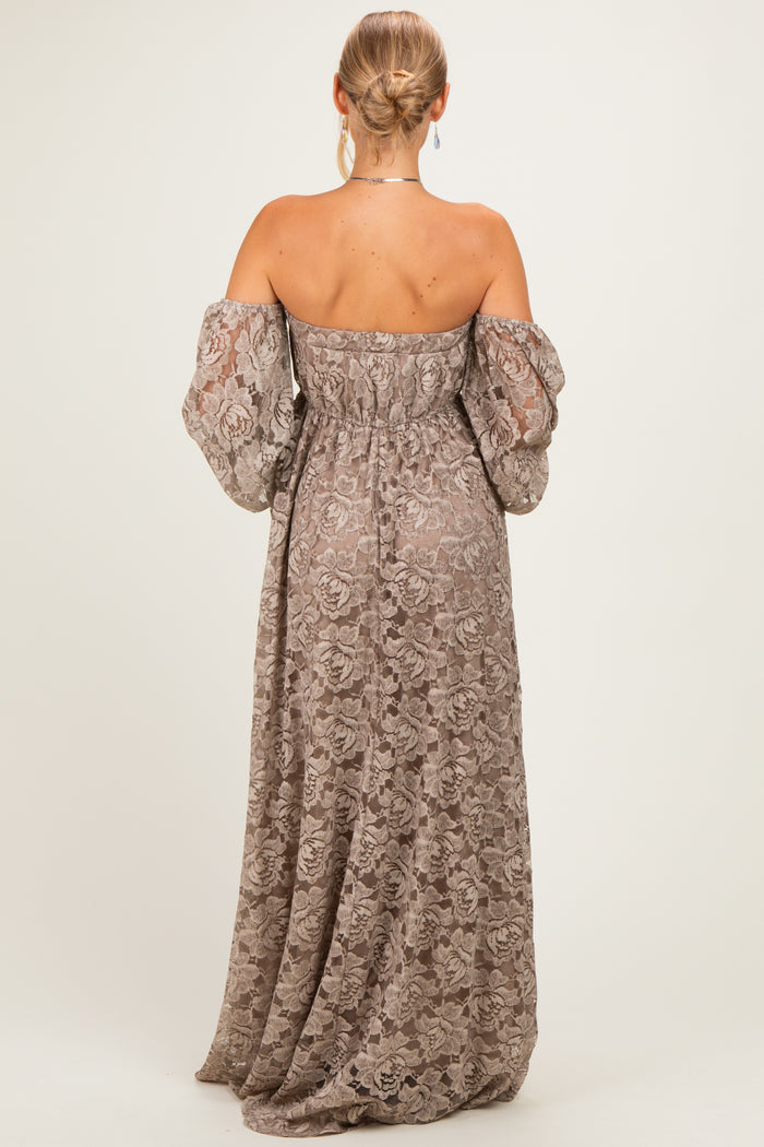 woman wearing a back view of a long, off-the-shoulder lace maxi dress in a muted taupe color