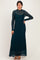 woman wearing a teal long sleeve lace maxi dress with a fitted silhouette and a flared hem