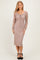 woman wearing a taupe long sleeve lace dress with a scoop neckline and fitted silhouette